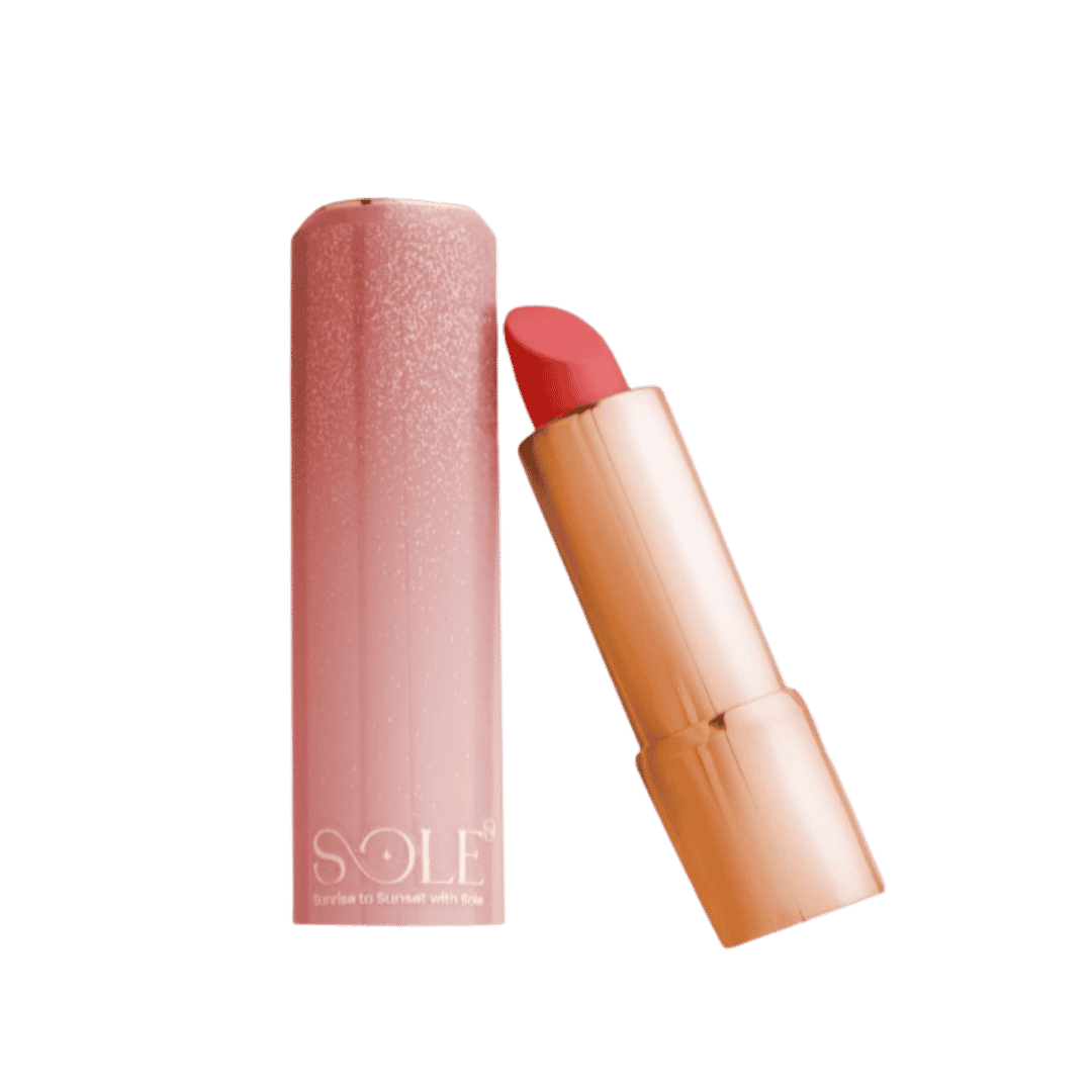 Sole lipstick coral shade with glitter pink case and gold bullet tube