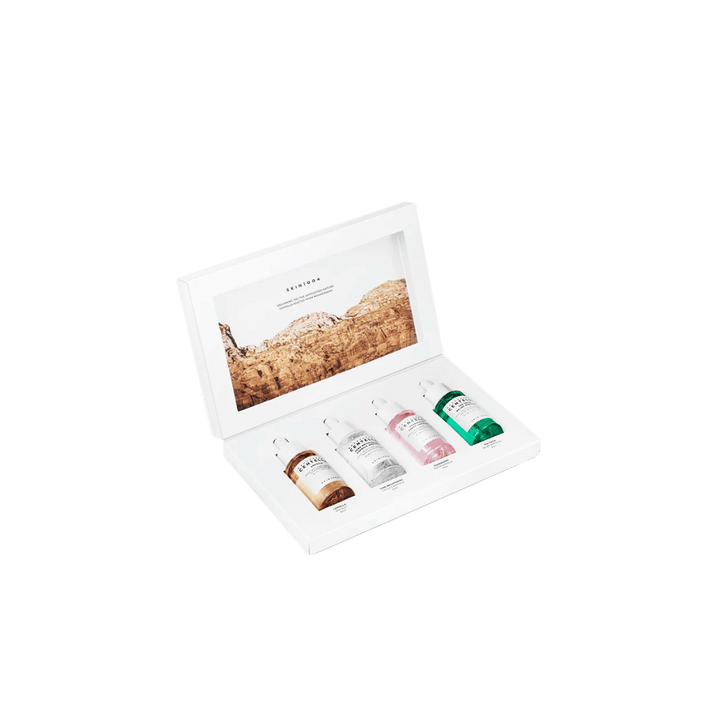 Skin1004 Centella Ampoule Kit, white rectangular box open with four ampoules in different colors, landscape graphic inside lid, 1000x1000px 