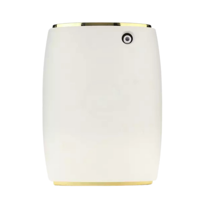 White electric scent diffuser with gold top and base trim.