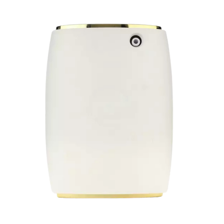 White electric scent diffuser with gold top and base trim.