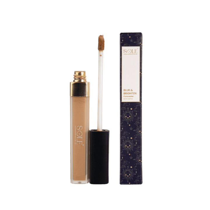 a bottle of Sole's "Blur & Brighten" Concealer with a gold and black tube and a doe-foot applicator.