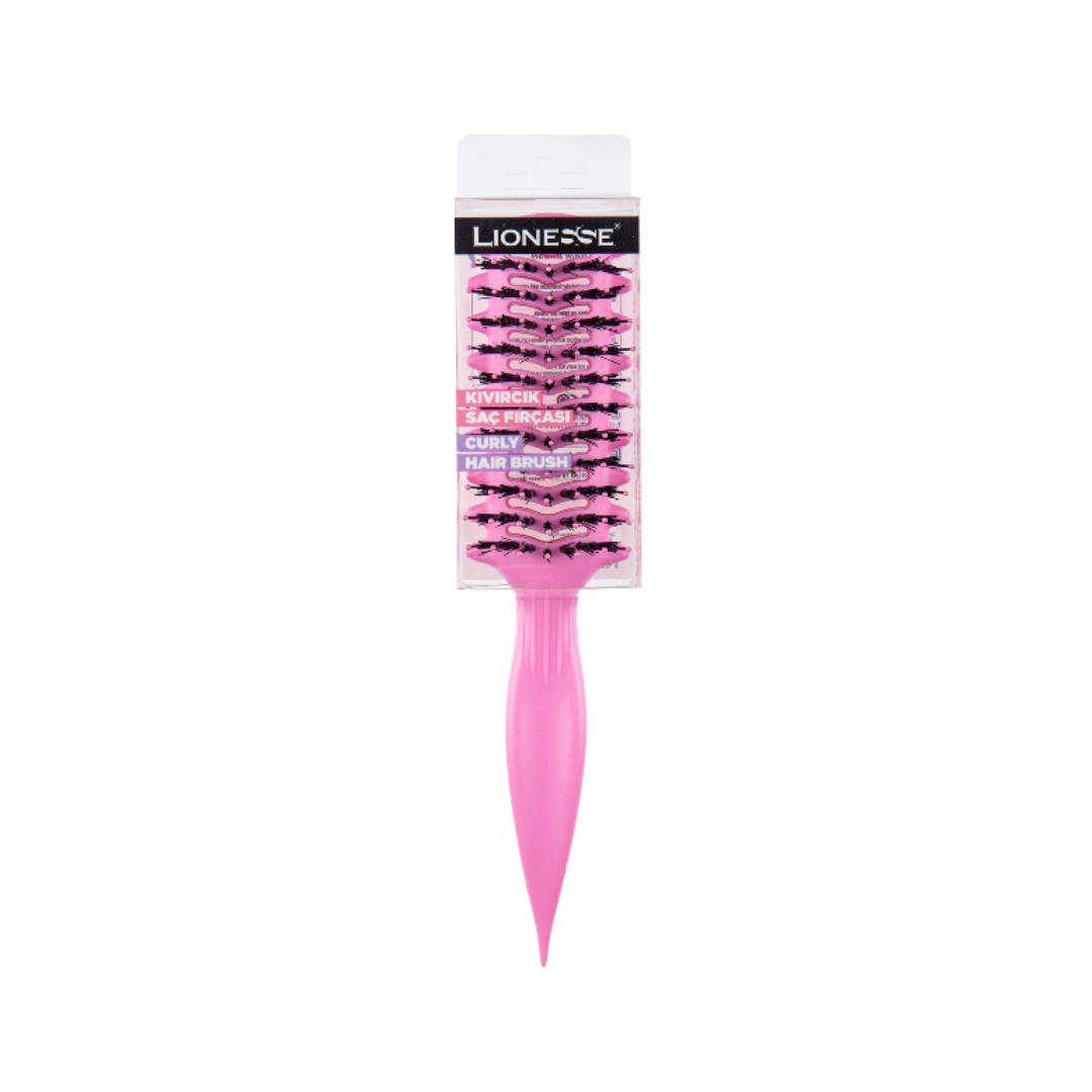 This image displays a pink curly hairbrush from the brand Lionesse. The brush has wide-set bristles designed specifically for detangling and defining curly hair without causing frizz. It features a long, pointed handle for easy control while styling.