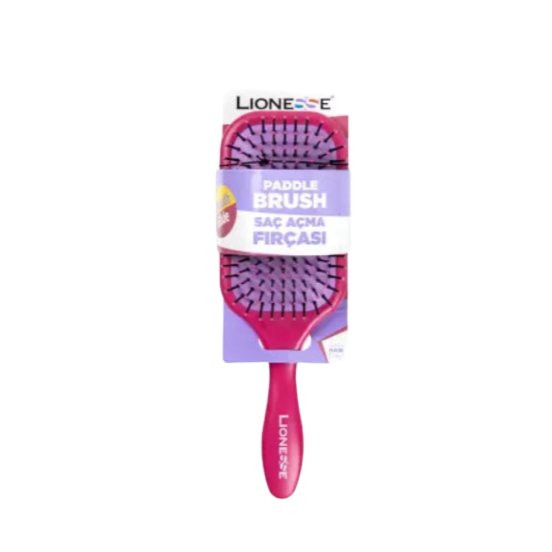 The image shows a "Paddle Brush" from the brand Lionesse. The brush is designed for detangling hair, with a wide head and soft bristles. The packaging includes the product name, "Paddle Brush," in both English and Turkish (Saç Açma Fırçası). The handle and bristles are pink and purple, respectively.