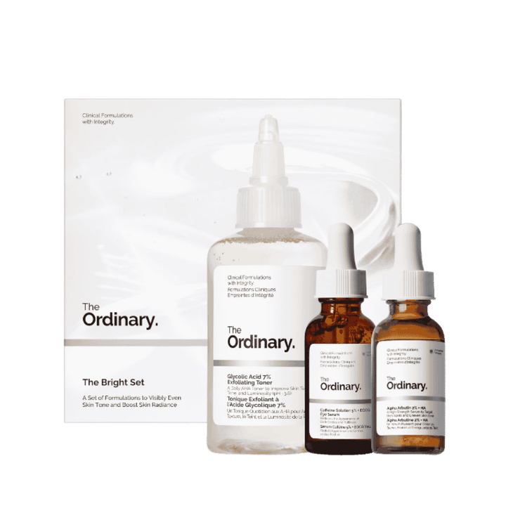 The Ordinary Bright Set skincare kit with Glycolic Acid toner, Alpha Arbutin serum, and Caffeine eye serum bottles