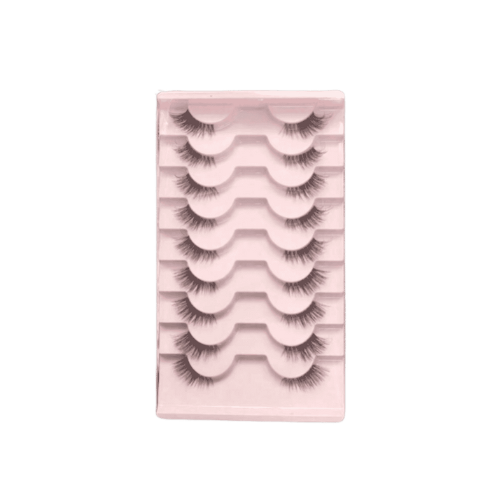 False eyelash set in pink plastic tray with six pairs of black lashes