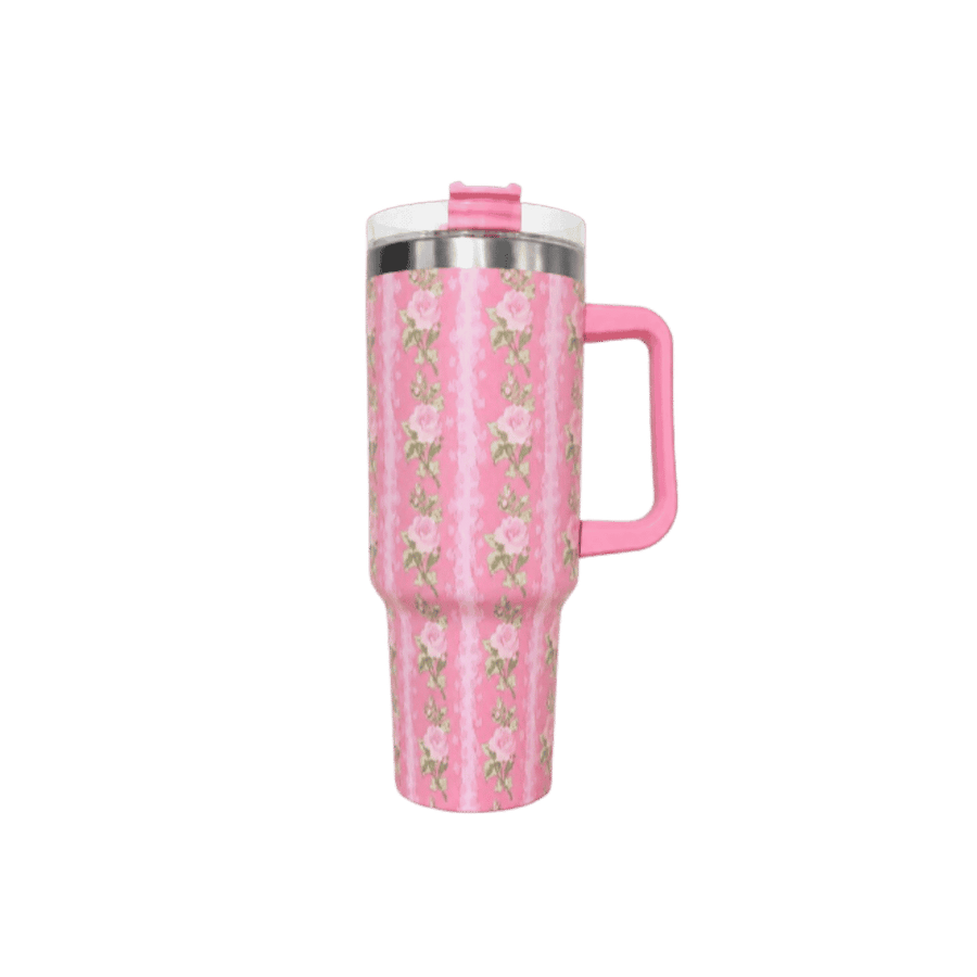 Pink floral insulated tumbler with handle, clear lid, pink straw topper, and stainless rim