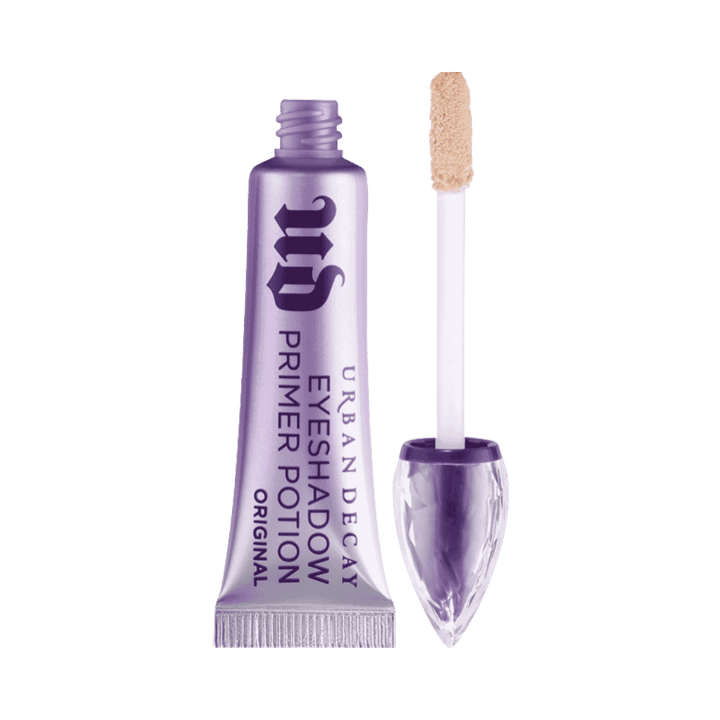 Urban Decay Original Eyeshadow Primer Potion purple tube with applicator wand and beige product on tip