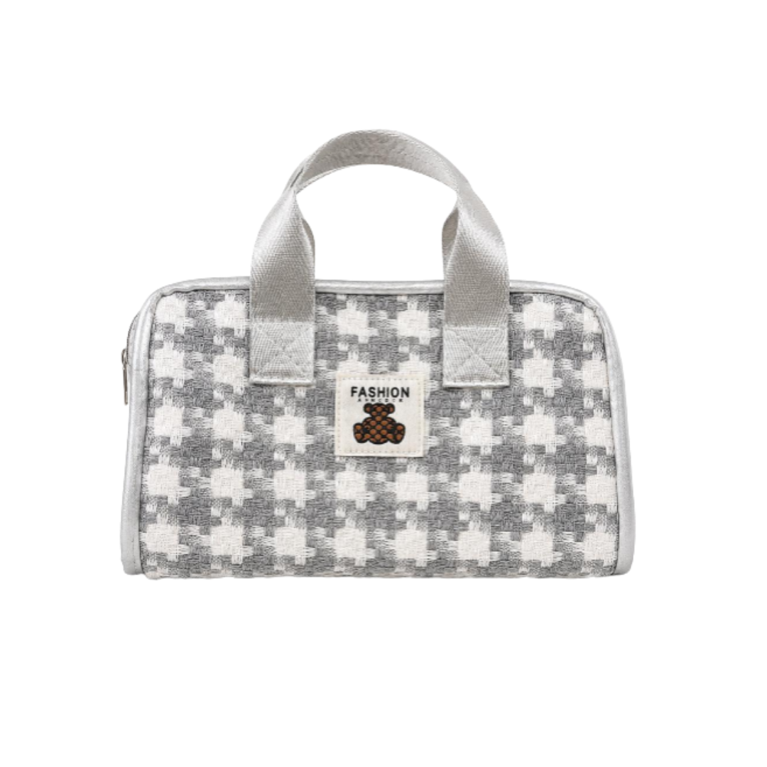Gray and white patterned cosmetic bag with two handles, zipper closure, and small Fashion patch.