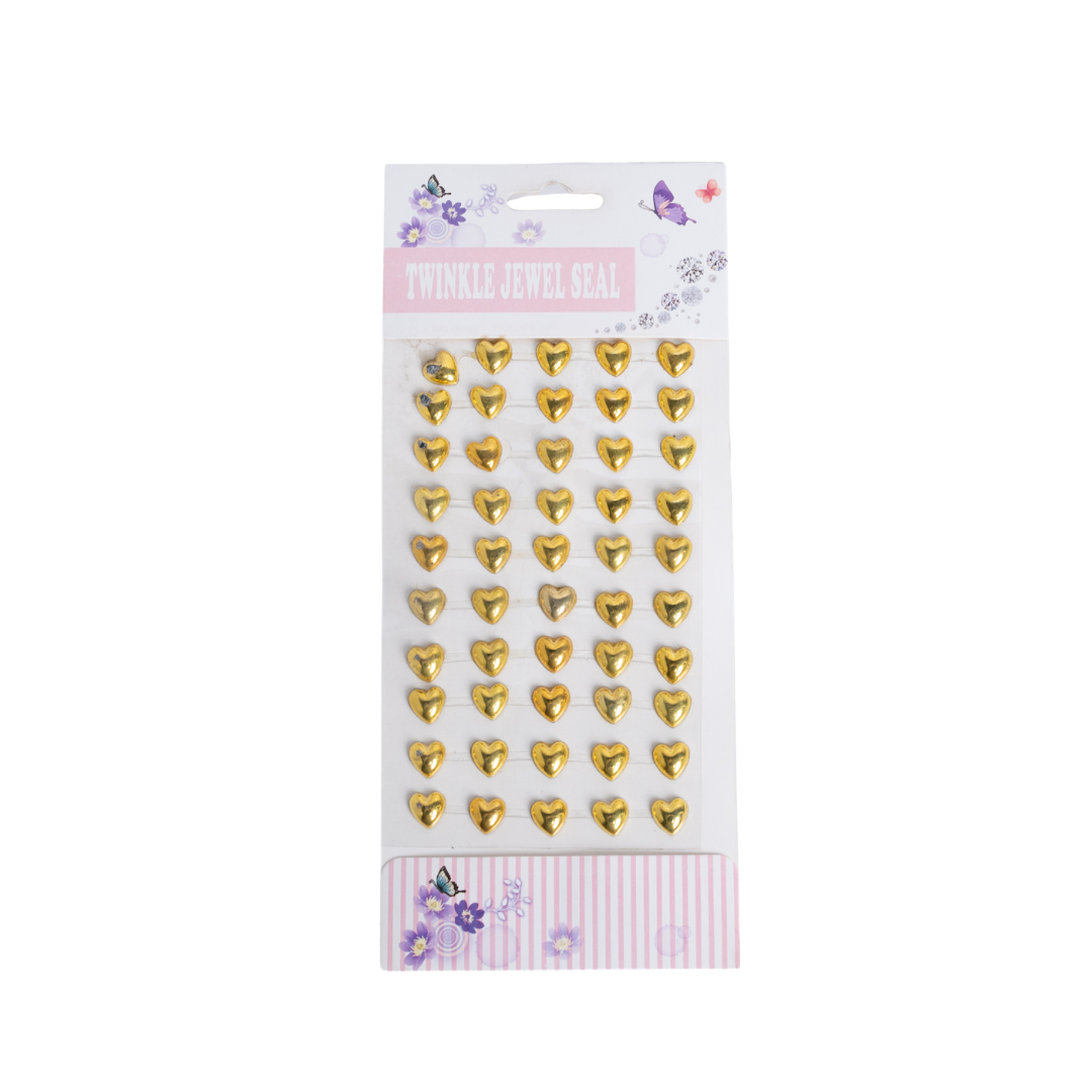 Wonder Face & Body Gems stickers set with gold heart-shaped decorative gems on sheet packaging.