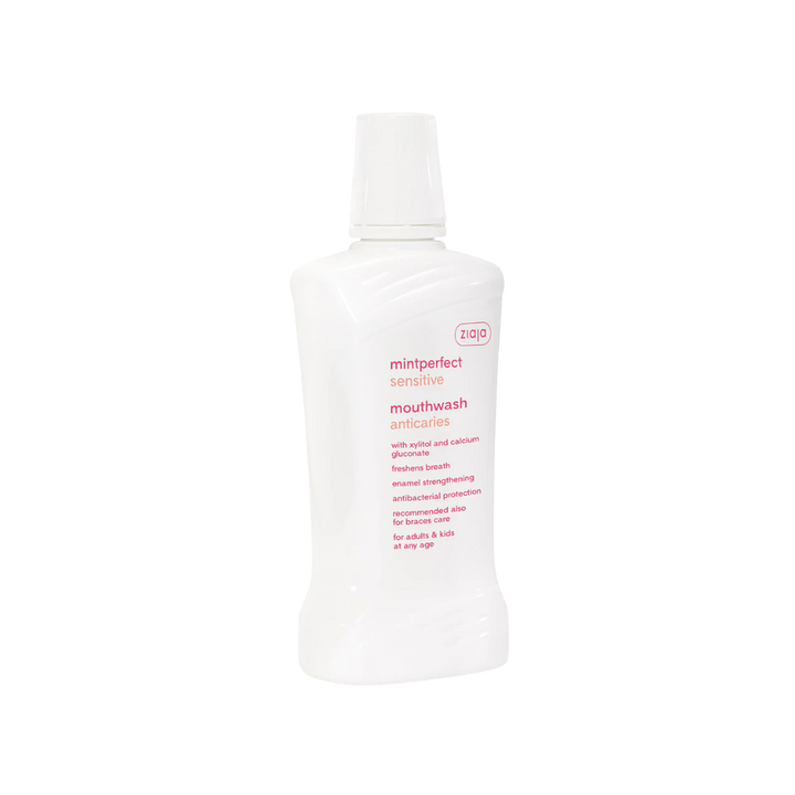 Ziaja Mintperfect Sensitive mouthwash anticaries, white plastic bottle, mint flavor, flip cap, oral care labeling.