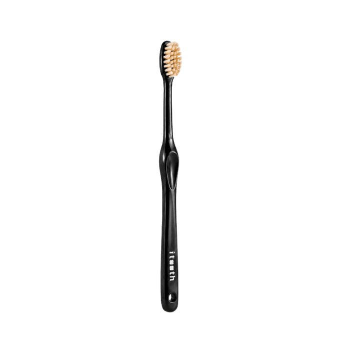 i tooth Smart Miswak toothbrush with black handle and compact beige miswak-infused bristles.
