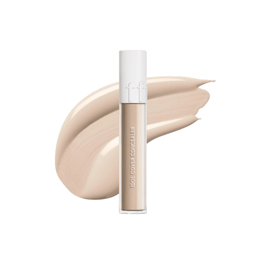 Tfit Idol Cover Concealer, frosted cylindrical tube with white cap, beige concealer swatch behind, printed text branding, 607x615px 