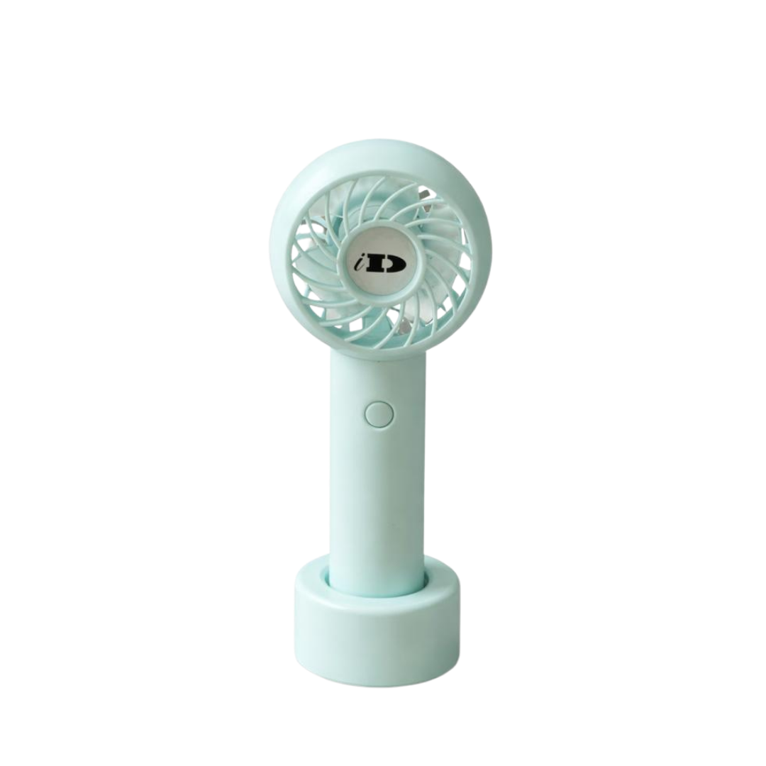 Wonder Fan mint green handheld fan with circular grille, front button, and matching desktop base