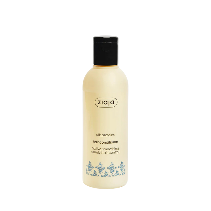 Ziaja Silk Proteins hair conditioner, beige plastic bottle with black cap, smoothing formula labeling visible.
